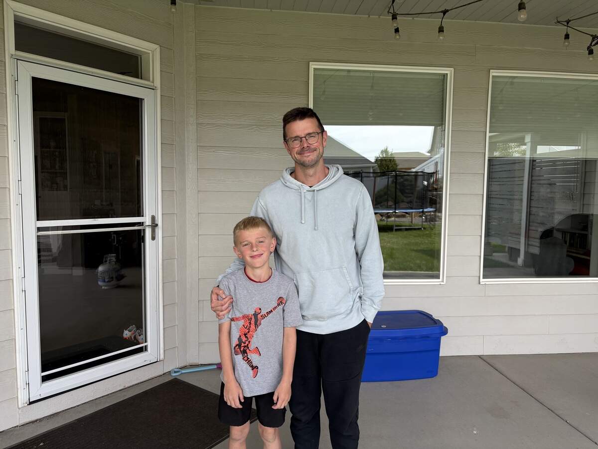 Jack Sims and his father, Marc, celebrate Jack breaking the Kid’s World Record for holding the longest plank earlier this year.