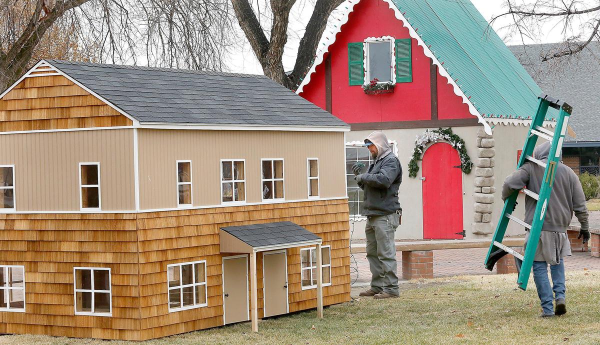 A replica model of a Richland “A” home is part of a Christmas Village display in John Dam Plaza for the holidays.