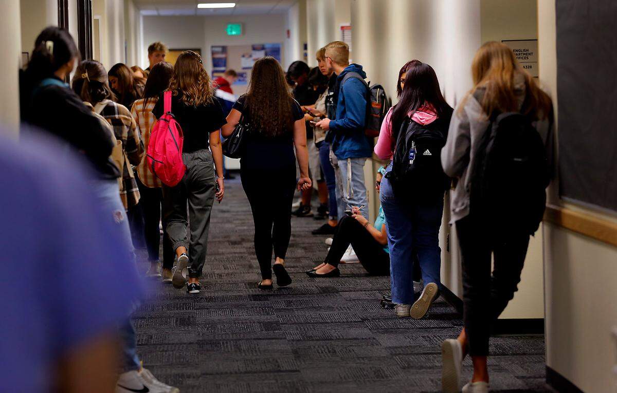 Students at the Columbia Basin College campus in Pasco wait in the English department hallway for their classrooms to open on the first day in this 2022 file photo.