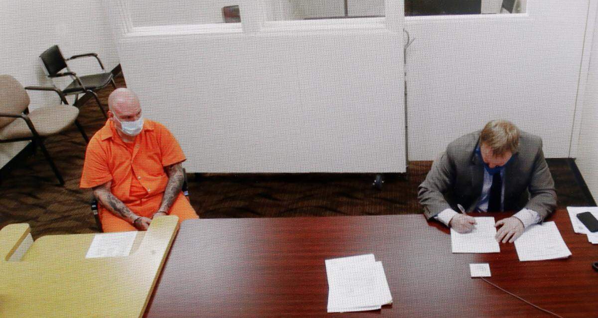 Soap Lake reserve police officer Shane W. Jones, 49, appears in Franklin County Superior Court Friday via a video link with provisional defense attorney Eric Scott.