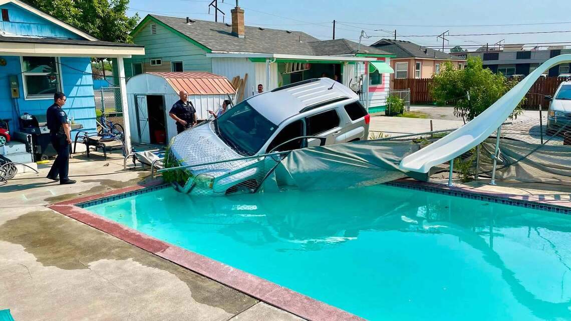 Weird day for Pasco police: SUV in swimming pool and a garbage truck fire