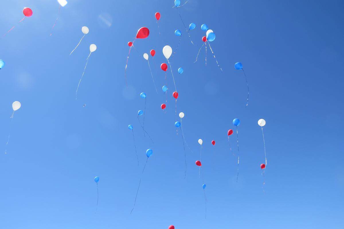 People released balloons following a Memorial Day service at Pasco's City View Cemetery. The event was one of several throughout the Tri-Cities remembering members of the U.S. Armed Services.