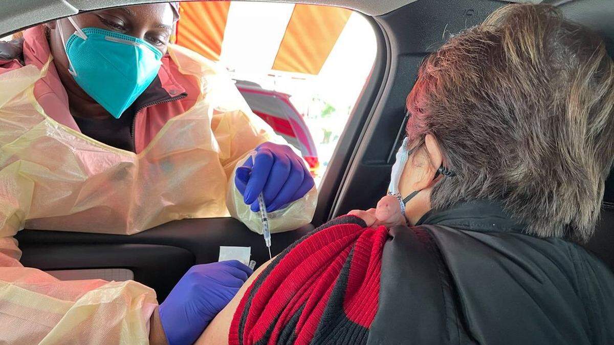 A shot of COVID vaccine is given at the drive-thru mass vaccination clinic at the Benton County Fairgrounds in Kennewick.