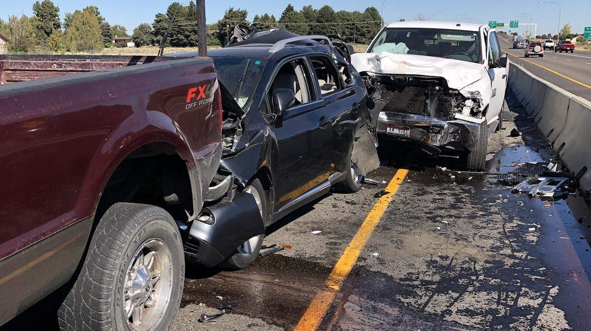 Smashed cars sit on southbound Highway 395 in Pasco after a six-car wreck Monday.