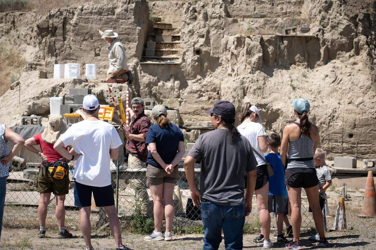 Visitors tour the Coyote Canyon dig site where MCBONES Research Center is unearthing Ice Age mammoth bones near the Tri-Cities.