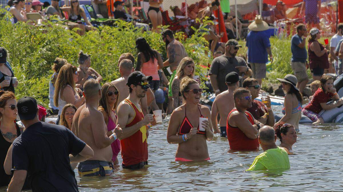 Water Follies fans cool off in the Columbia River between races at the 2018 HAPO Columbia Cup & Over the River Air Show on Saturday. The events continue Sunday on both sides of the river.