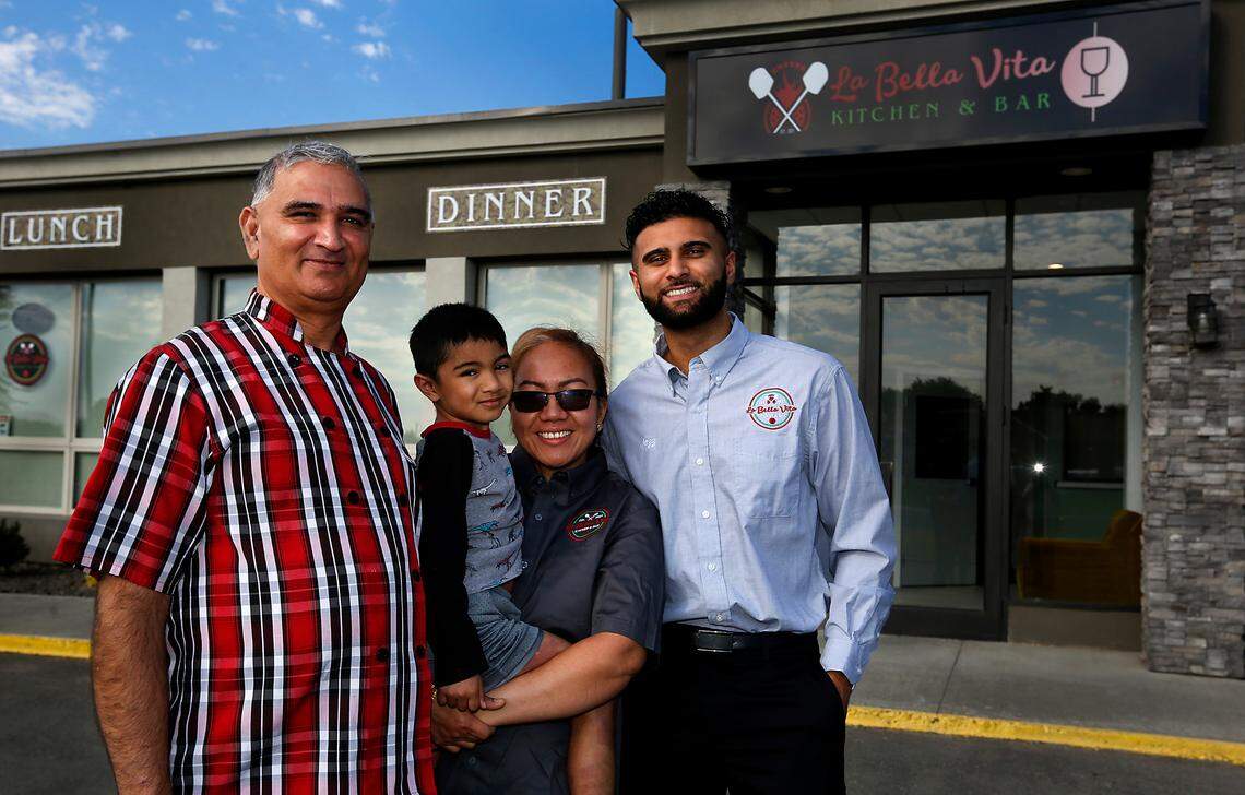 The Thind family have recently opened La Bella Vita Kitchen and Bar at 1515 George Washinton Way in Richland. Pami Thind, left, is the chef and runs the restaurant with his wife, Ayrene, and his adult son, Jazz, at right, Ayrene holds their 5-year-old son, Nathan.