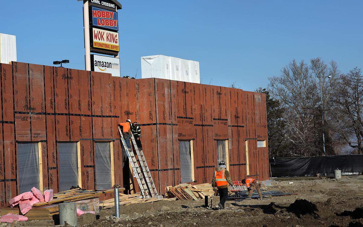Crews work on the exterior wall panels for the new 5,000-square-foot Chick-fil-A restaurant at 7009 W. Canal Drive in Kennewick. The new building includes a kitchen, inside seating for 70, patio seating for 24, 96 parking stalls and features a two-lane drive through. The existing parking lot has fenced off for construction of the structure. Photo taken on Feb. 12, 2025.