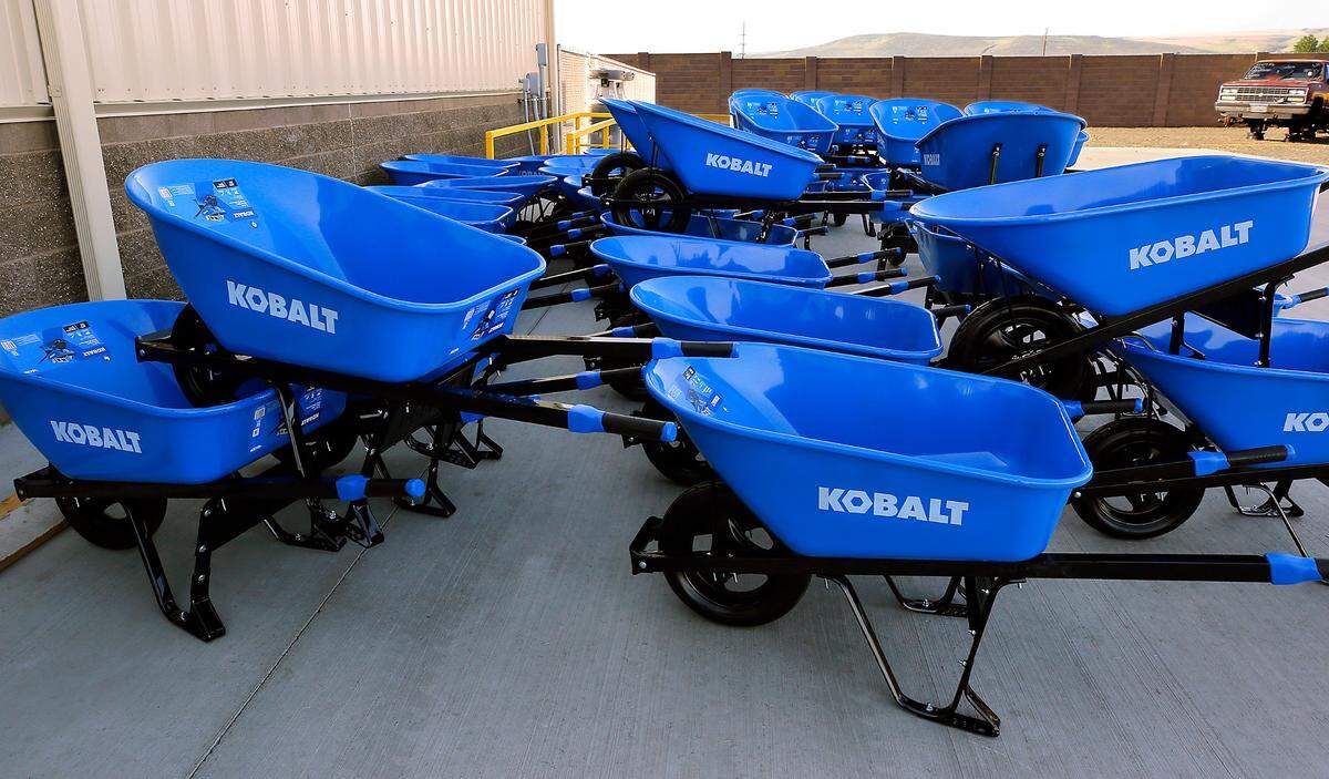 New wheelbarrows for customer use are stacked outside the new location.