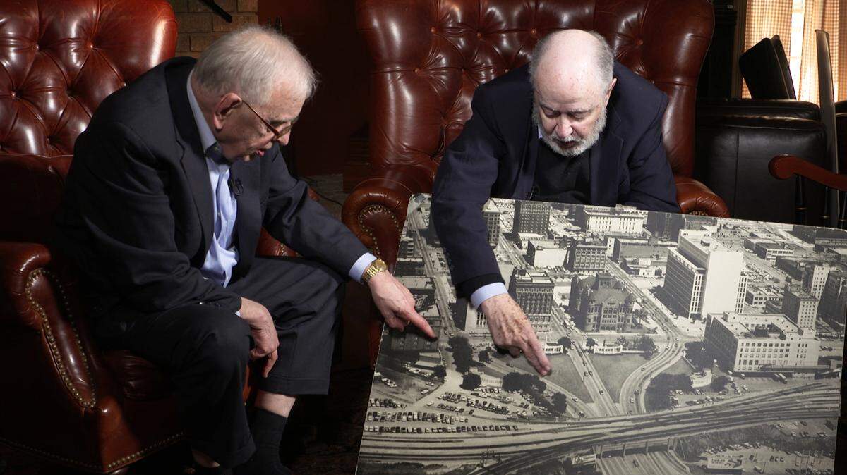 G. Robert Blakey (R) Chief Counsel of the House Select Committee on Assassinations with Judge Burt Griffin (L), Warren Commission Assistant Counsel, Cuyahoga County Court of Common Pleas, Retired, Cleveland OH, examine a photo of Dealey Plaza.