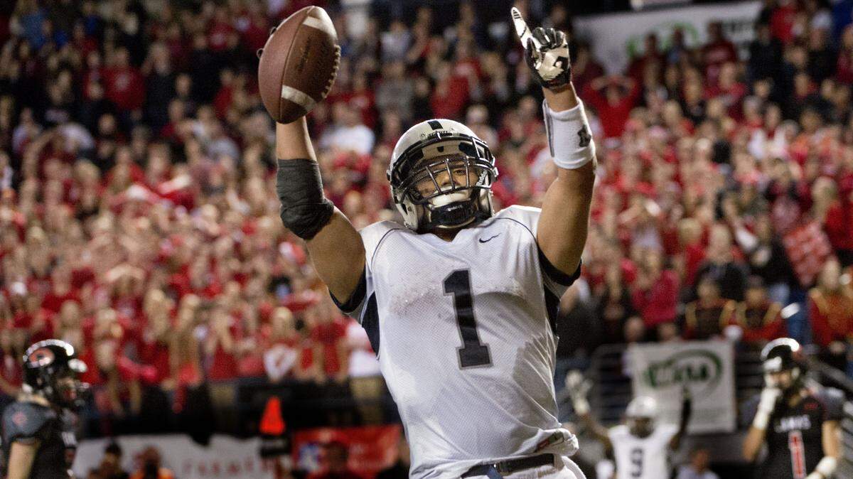 Chiawana's Clifton Lozano celebrates in the end zone after scoring Chiawana's second touchdown at the Tacoma Dome on Saturday, Dec. 7, 2013.