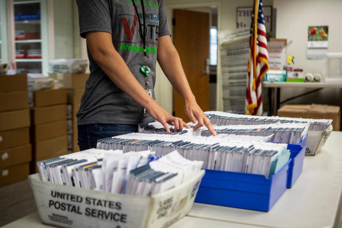 Amanda Hatfield, elections manager with the Benton County Auditor’s Office in Prosser, shows the local ballots that were not counted for various reasons during the Aug. 4, 2020, primary election.