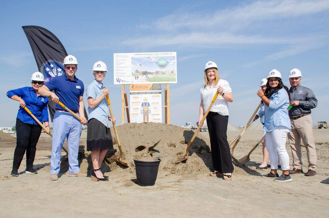 Pasco School Board members and school Superintendent Michelle Whitney break ground Thursday, Aug. 17, at the future site of the district’s thid comprehensive high school. 