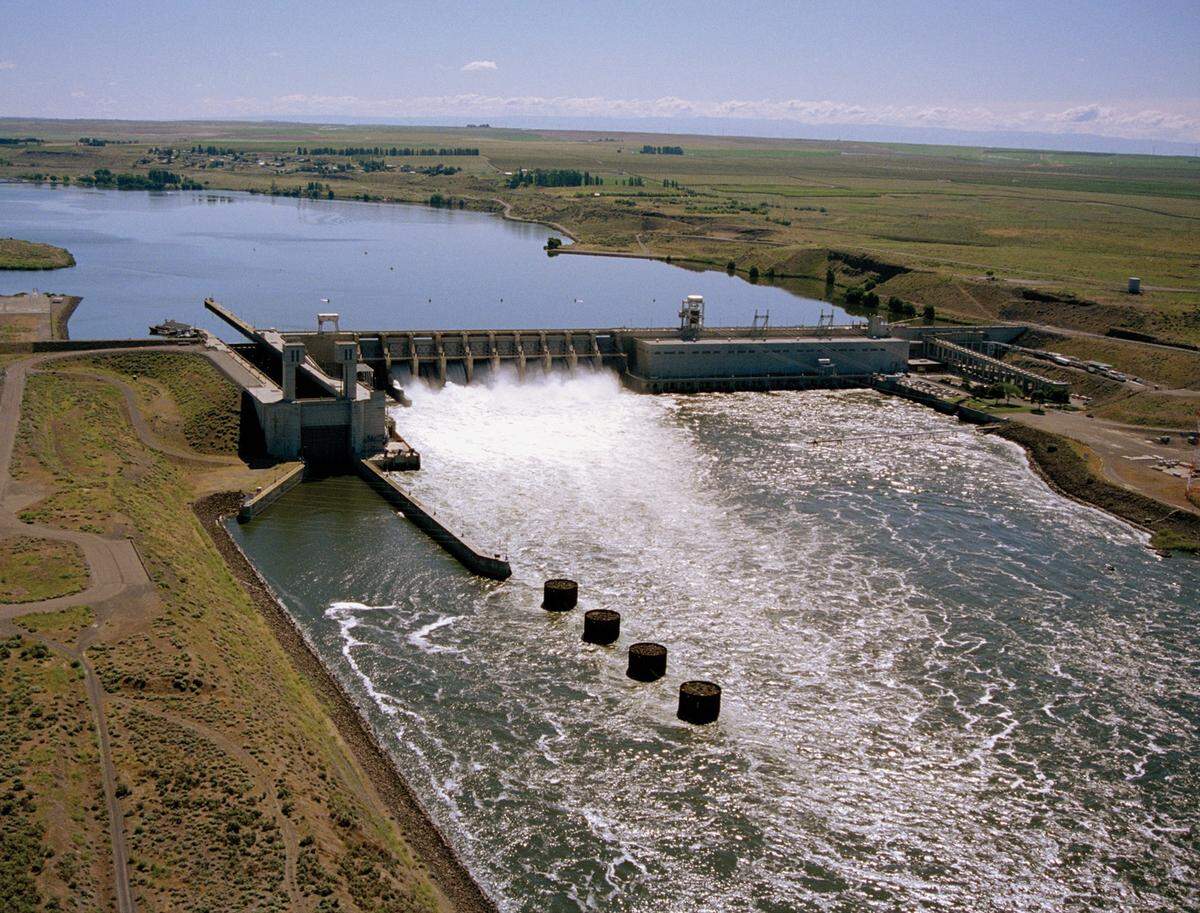 Water pours through the Ice Harbor Dam on the Snake River east of Pasco. It is one of four lower Snake River dams covered in an environmental review that will look at whether removing the dams is the best option to improve salmon runs.