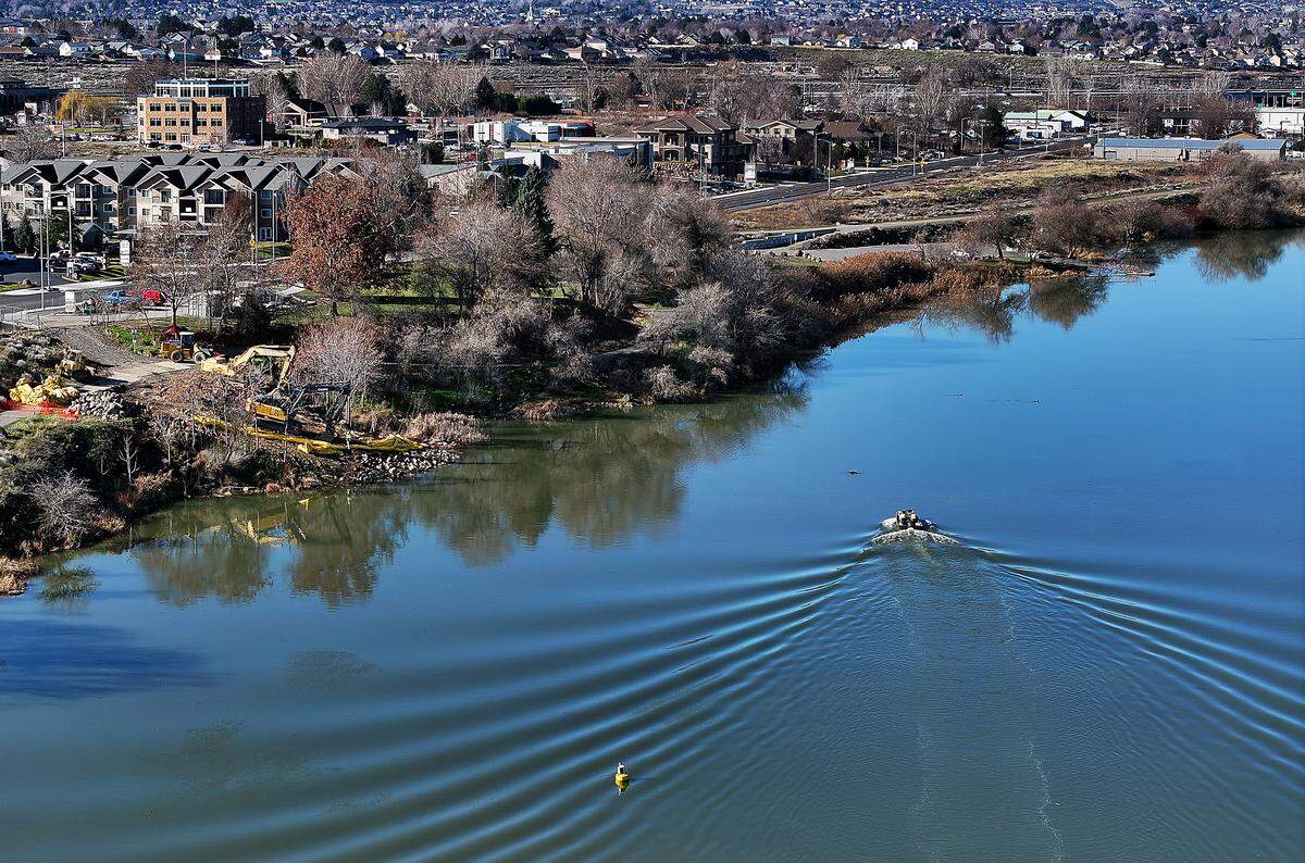 Crews have removed the floating construction boom from the water signaling the completion of the Bateman Island causeway removal project in Richland.