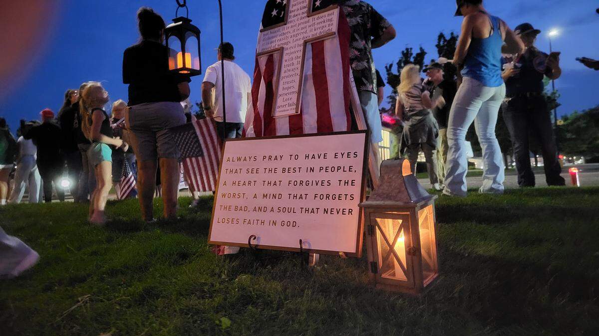 People gathered Saturday night in front of Sterling’s Restaurant on Queensgate Drive to have a candlelight vigil for conservative political influence Charlie Kirk.