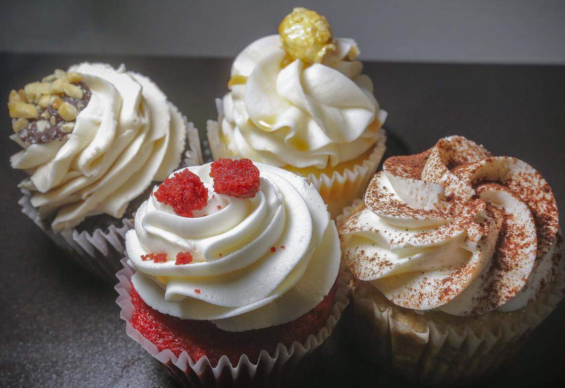 Frost Me Sweet cupcakes from the back left: peanut butter chocolate and salted caramel, from the front left, red velvet and tiramisu.