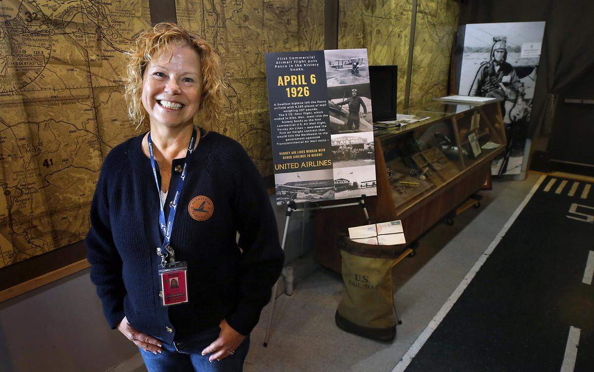 Malin Bergstrom stands near the Pasco Airmail Centennial Exhibit to be unveiled at the Pasco Aviation Museum for the celebration of the first ever delivery by plane of U.S. postal mail that took from Pasco in 1926. 