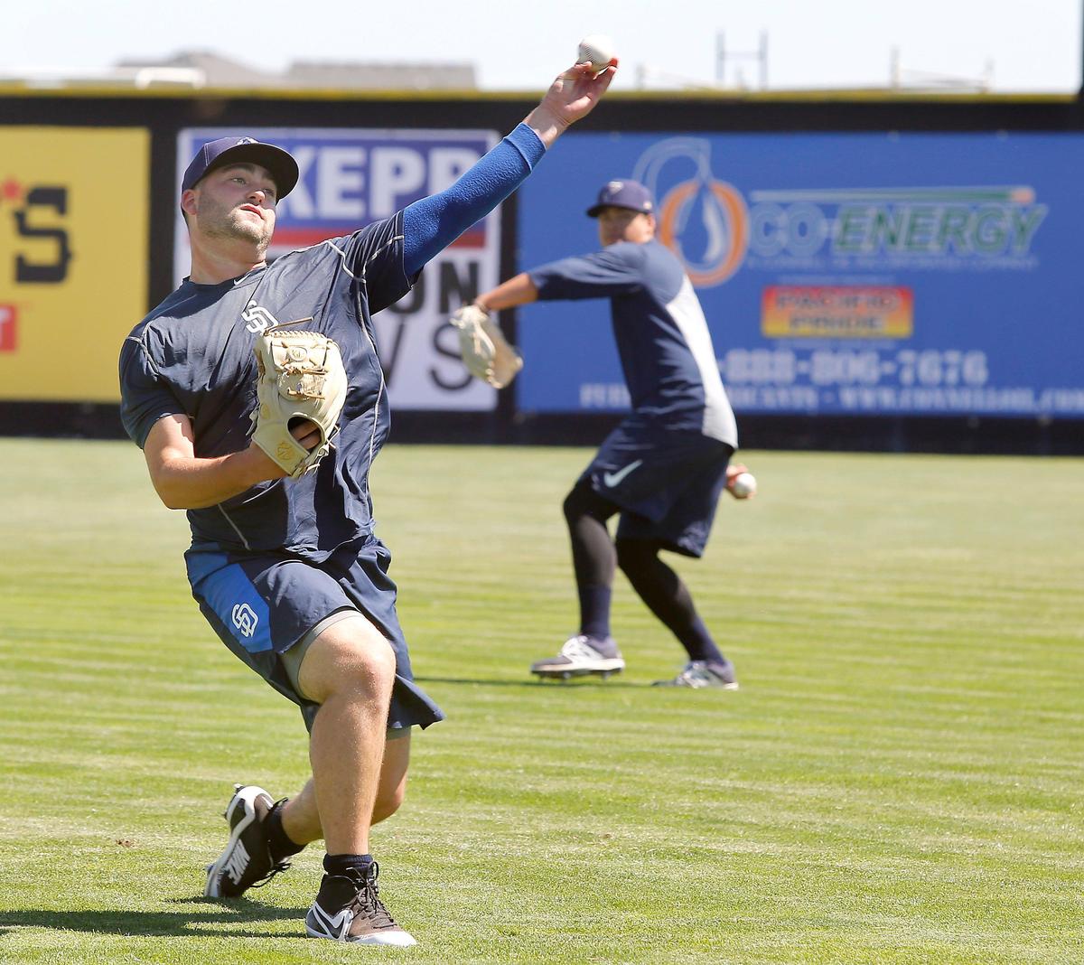Pitcher Dan Dallas, a left-handed reliever, warms up with throwing exercises during Tuesday’s practice at Gesa Stadium in Pasco. Dallas will be a familiar face for Tri-City Dust Devils fans because he is one of at least nine players on the 26-man roster who played for the team last year. Watch a video at: tricityherald.com/video