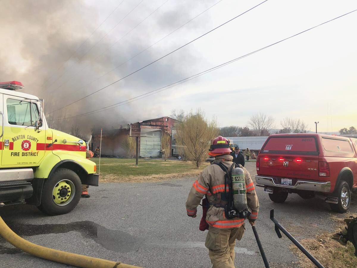 Firefighters are on the scene of a burning garage at the intersection of Lechelt Road and Highway 397 in Finley.