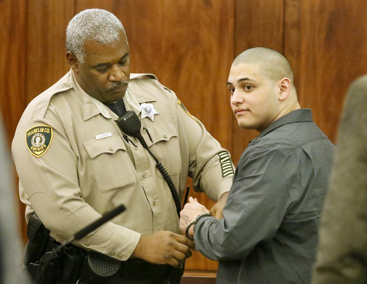 Pedro Cadenas, 18, is handcuffed by a corrections officer following a guilty verdict Monday in his murder trial in Franklin County Superior Court. Watch a video at: tricityherald.com/video