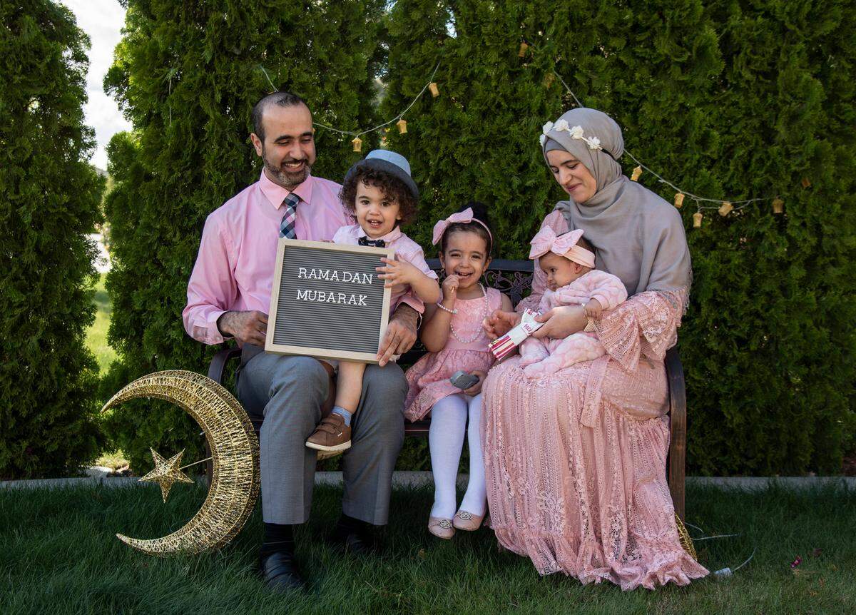 From left to right, Dr. Salaam Sallaam, Abdullah, 1.5, Ayah, 3, Talia, 2 months, and Somayyah Sous sit for a family portrait outside of their home in Richland.