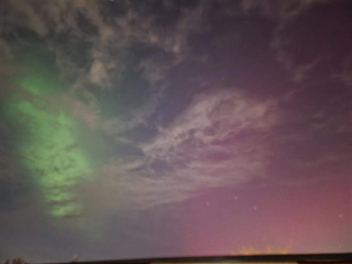 Derek Schroeder took this photo of the northern lights near his home in central Richland Tuesday evening. It was his first time seeing them.