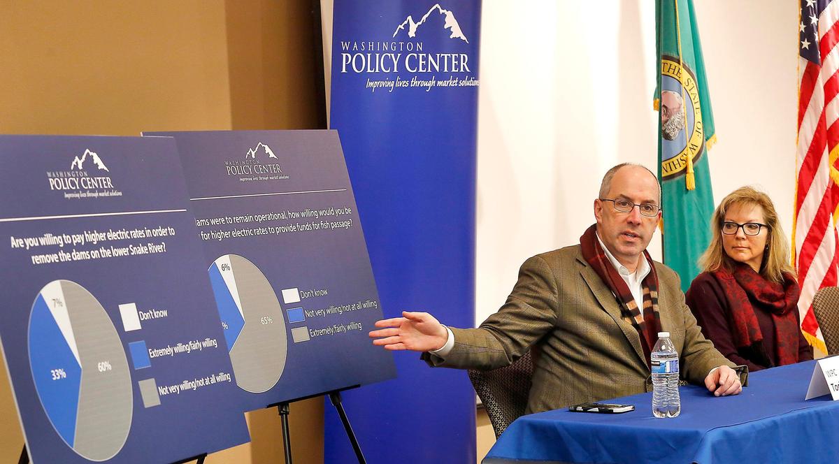 Todd Myers with the Washington Policy Center refers to charts during Tuesday’s news conference about their poll of 500 Washington citizens on removing dams from the lower Snake River. Sen. Sharon Brown, R-Kennewick, also took part in the event in Kennewick. Watch a video at: tricityherald.com/video