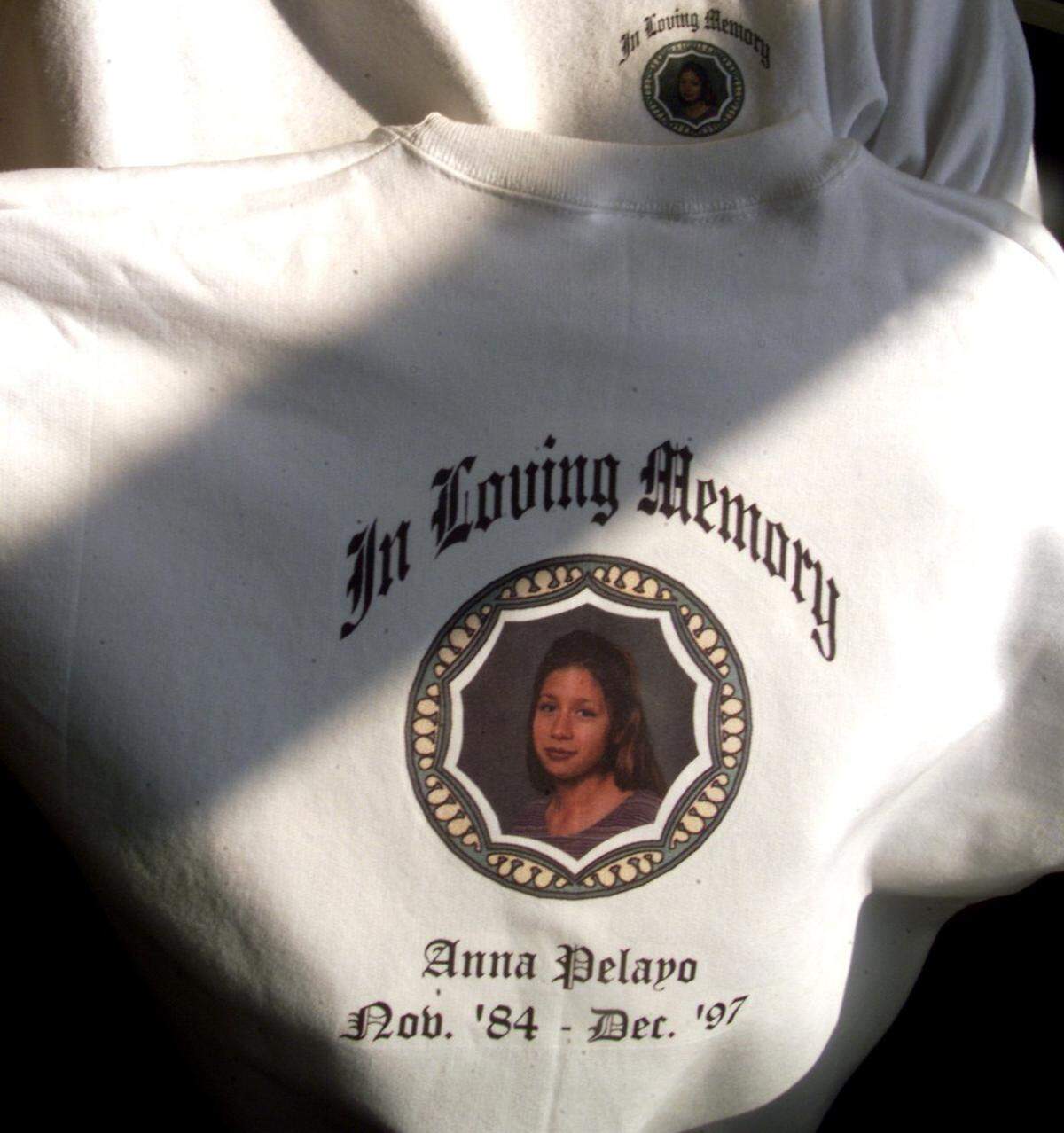 Christine Pelayo, mother of 13-year-old slaying victim Anna Pelayo, holds a sweatshirt she was selling in 1998 as a fund-raiser for reward money for information leading to the arrest and conviction of her daughter's killer.