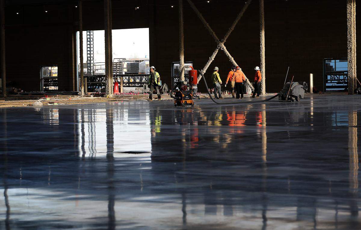 Construction crews work on the Three Rivers Convention Center renovation and expansion project Tuesday afternoon in Kennewick. 