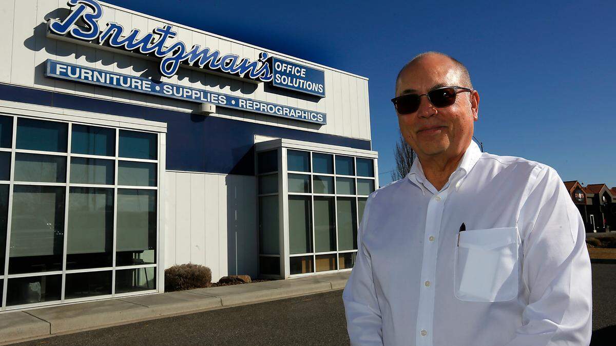 Ken Brutzman, vice president of Brutzman’s Office Solutions, stands outside the store on North Columbia Center Boulevard in Richland.
