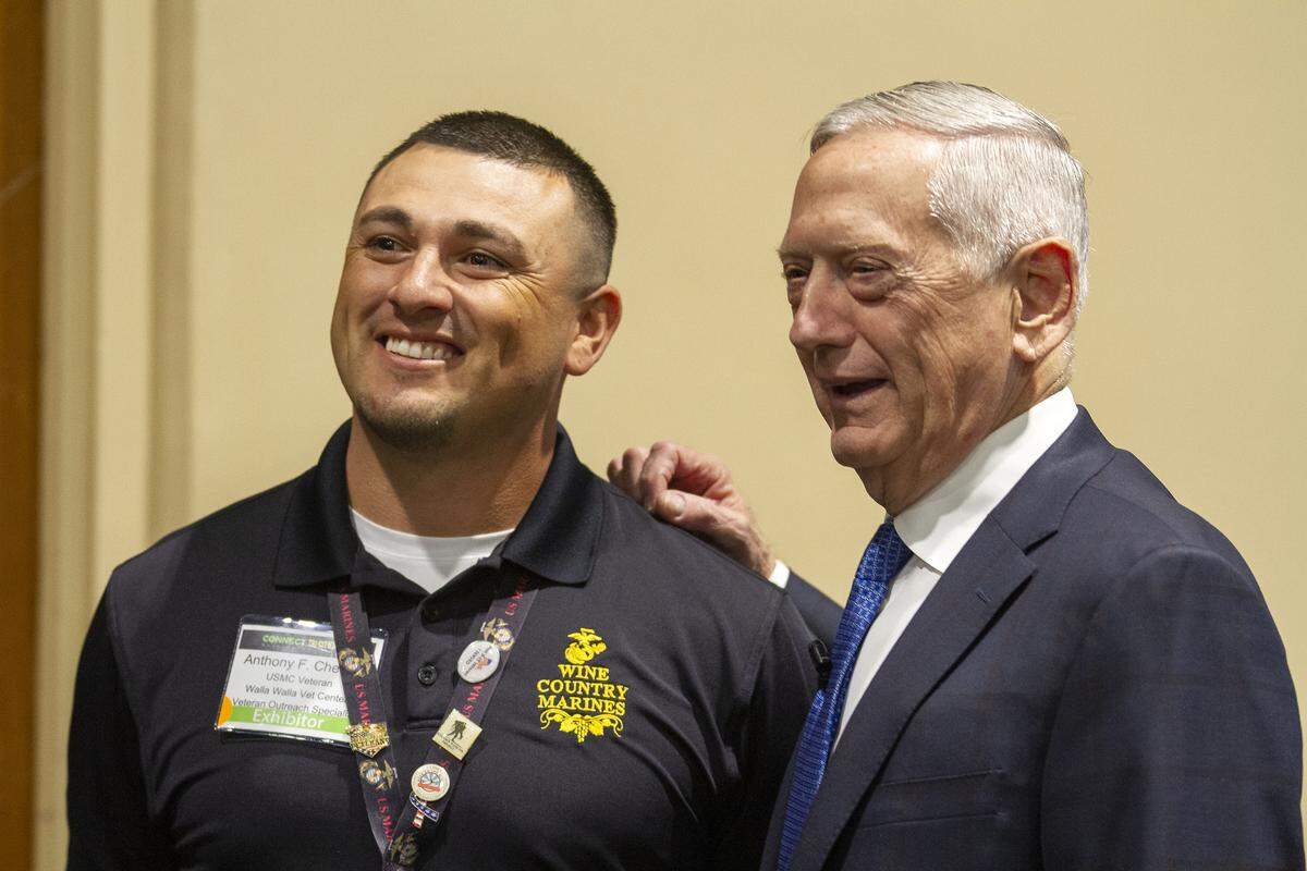 United States Marine Corps veteran Anthony Chester, left. takes a photo with Former Secretary of Defense Jim Mattis during Connect Tri-Cities at the Three River-Convention Center in Kennewick. Mattis walked through the event greeting and talking to veterans.