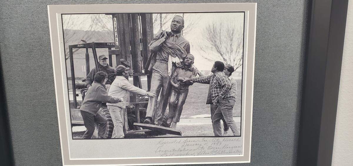 A Tri-City Herald photo showing the Martin Luther King Jr. statue being erected is featured in the boardroom at Columbia Basin College. Edgar Hargrow was a central force in raising funds for the statue.