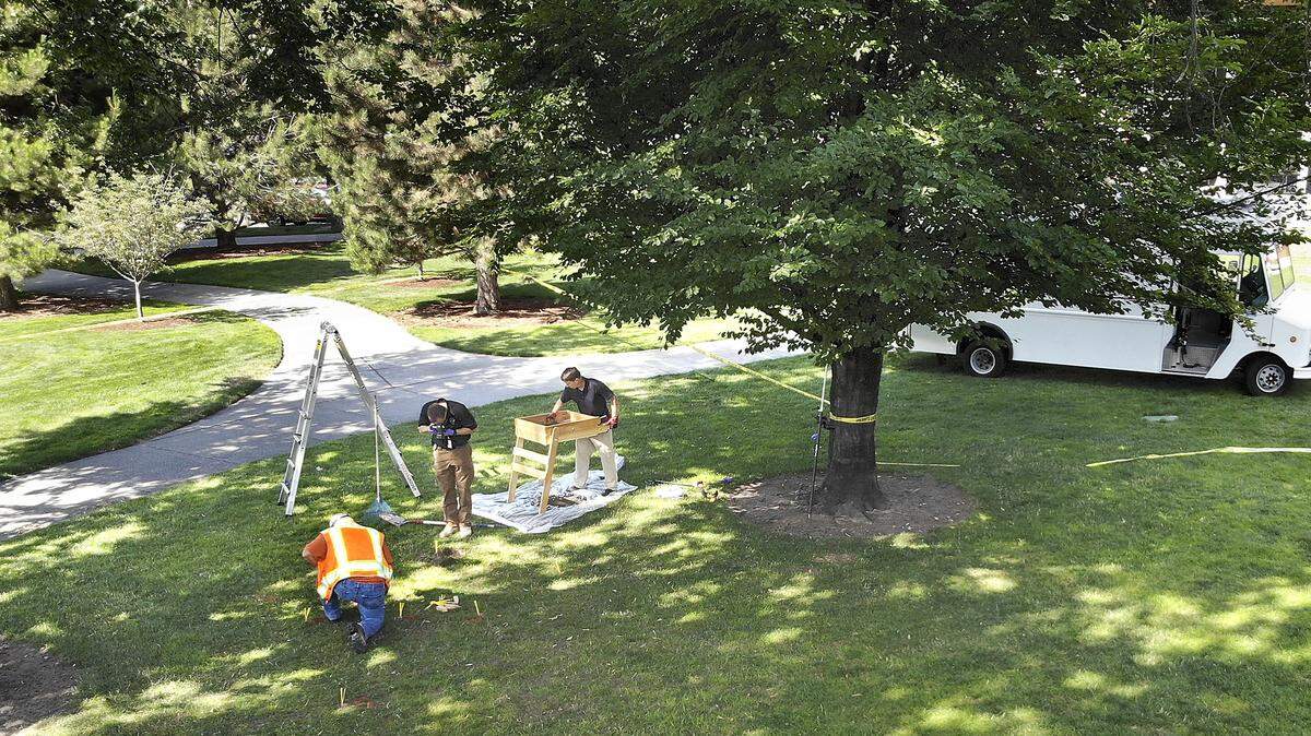 Two Tri-City men have been charged with the Fourth of July shooting in Richland’s Howard Amon Park that sent hundreds of people running for safety. Richland police were helped by a city surveyor look for evidence the next day.