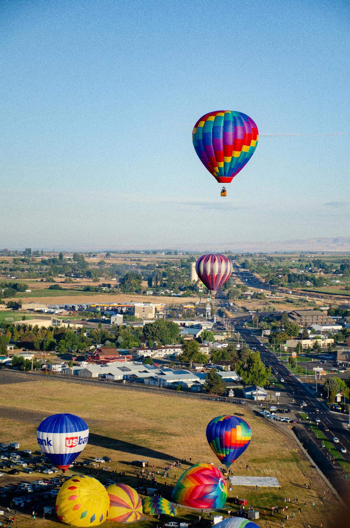 Hot air balloons take off early Friday morning during the 33rd annual Great Prosser Balloon Rally in Prosser, WA.