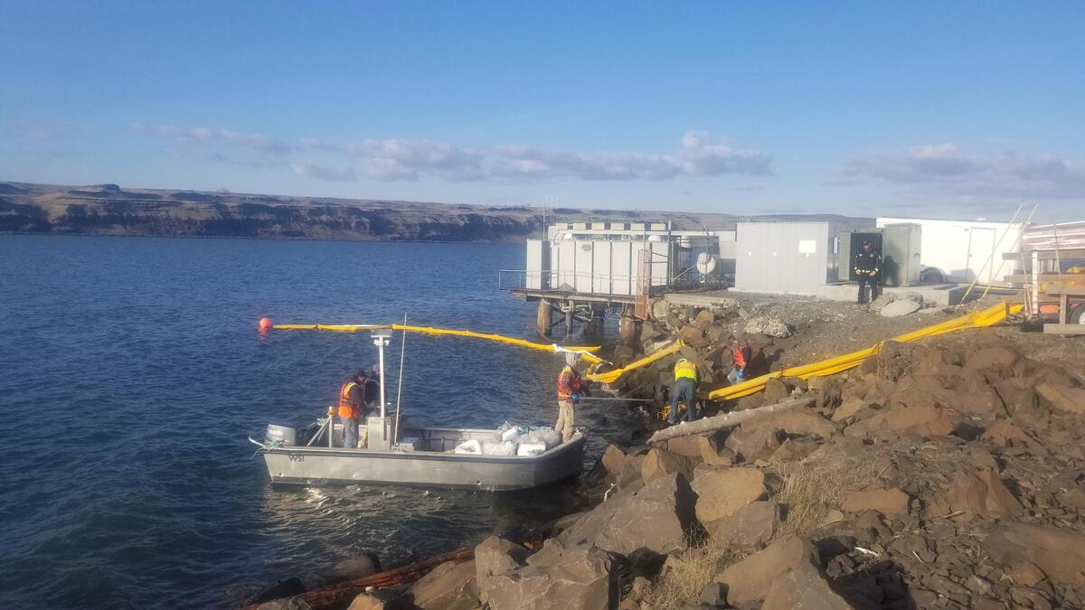 Booms are being placed in the Columbia River to contain any diesel fuel released from a tugboat that sank 10 miles upriver of McNaary Dam.