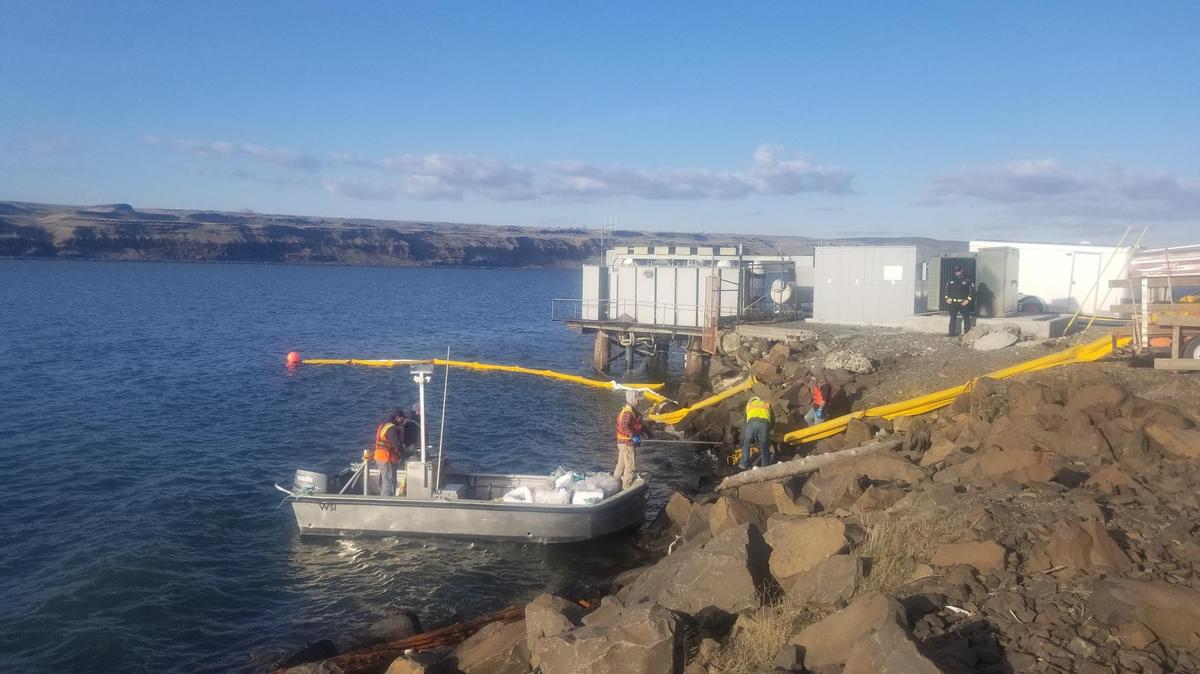 Booms are being placed in the Columbia River to contain any diesel fuel released from a tugboat that sank 10 miles upriver of McNaary Dam.