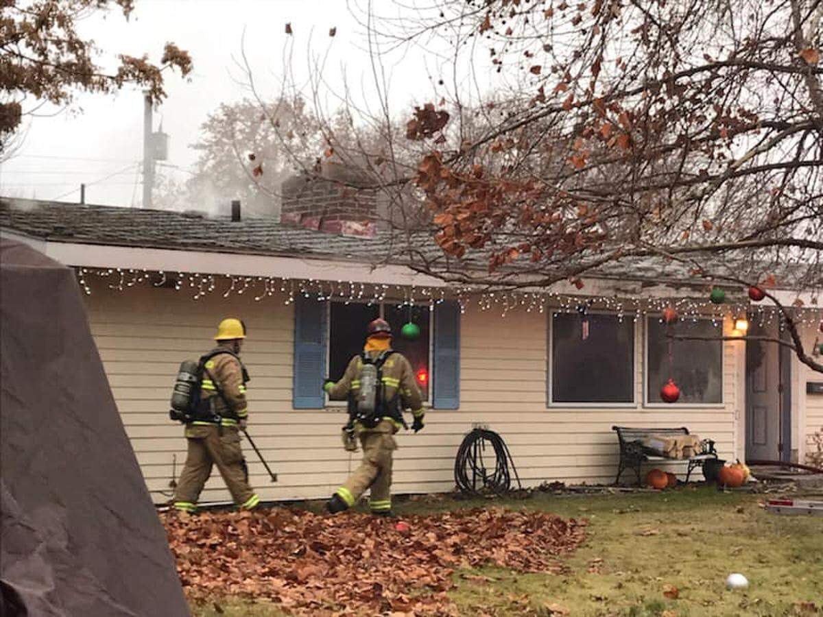 Kennewick firefighters responded to a home on Johnson Street after a passerby spotted smoke coming from the roof.