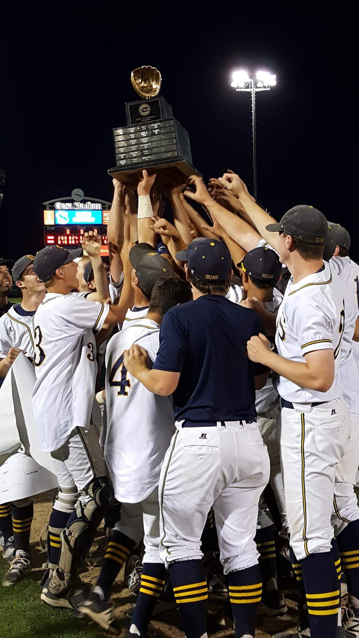The Southridge Suns celebrate their 11-6 victory over Kelso in the 3A state title game Saturday at Gesa Stadium in Pasco.