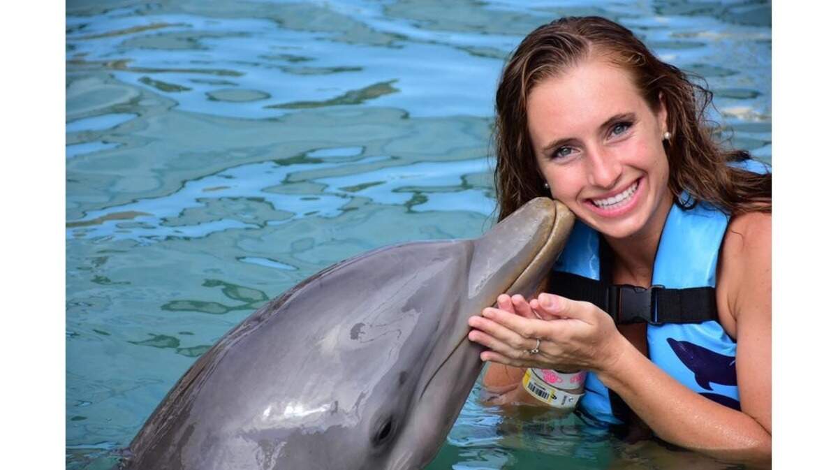 Hanford High School graduate Amanda Bogen at Dolphin Discovery Costa Maya on Mexico's Yucatan Peninsula. Bogen works as an assistant cruise director for Holland America Line and will soon return home from a four-month voyage around the world.