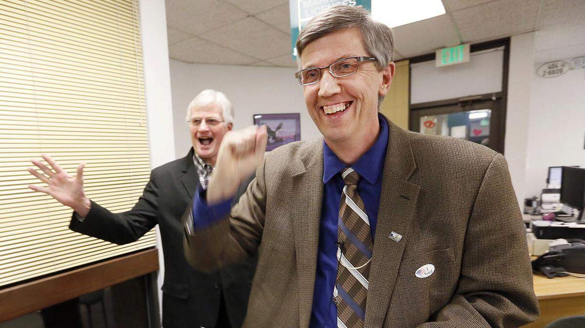 Dave Bond, superintendent of the Kennewick School District, right, and Kevin Veleke, chairman of the Kennewick Citizens’ Levy Committee, celebrate in February 2015 after seeing results for a school bond election.