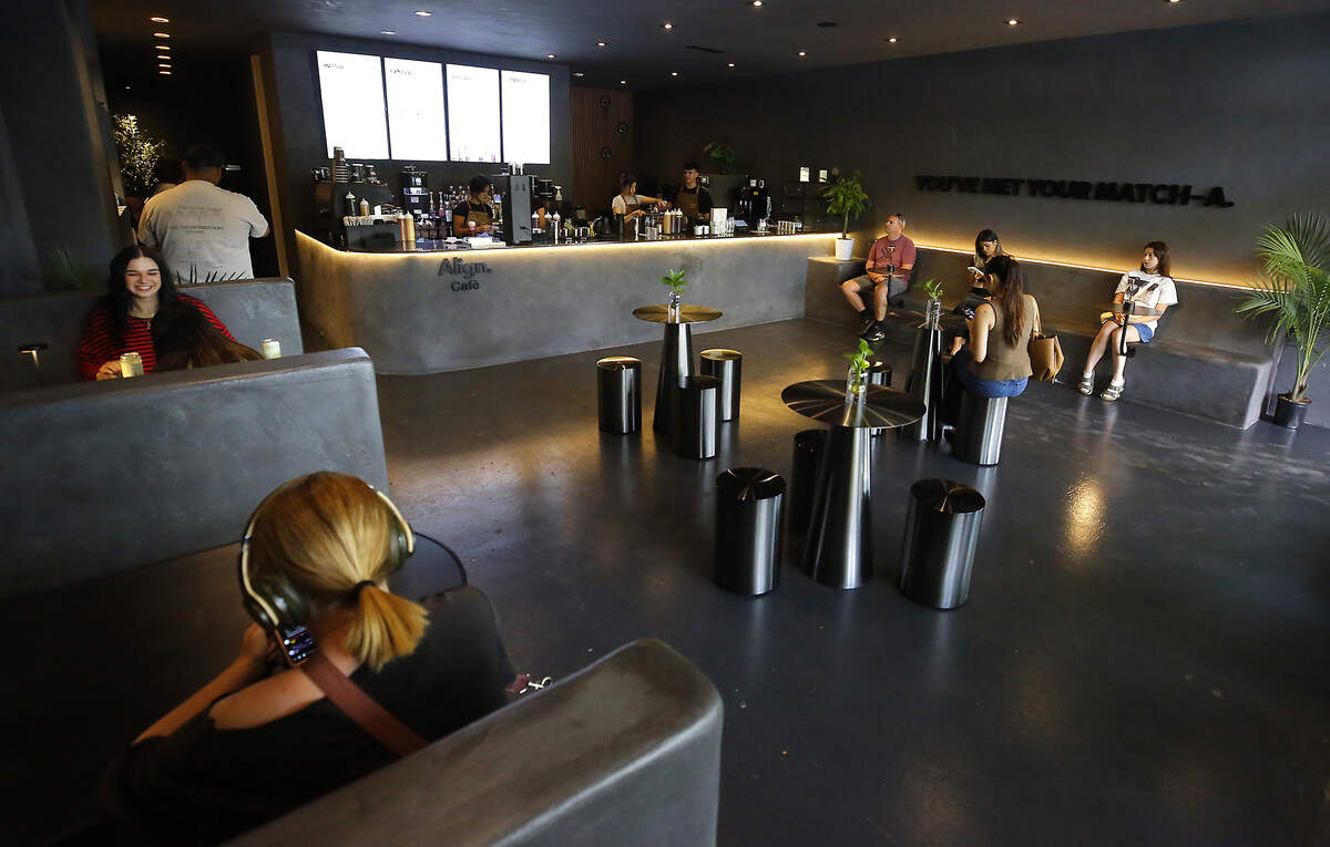 Customers wait for their orders and others enjoy drinks at the Align Cafe, which opened on June 3, at 616 The Parkway in Richland.