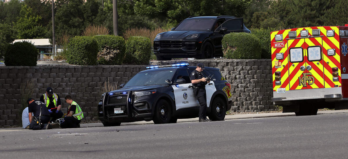 Kennewick Fire first responders check the medical condition of the distraught driver involved in Monday morning’s fatal collision involving a pedestrian on West Gage Boulevard at North Louisiana Street. A Kennewick Police officer flies a drone to record the scene where a 61-year old Kennewick man died.