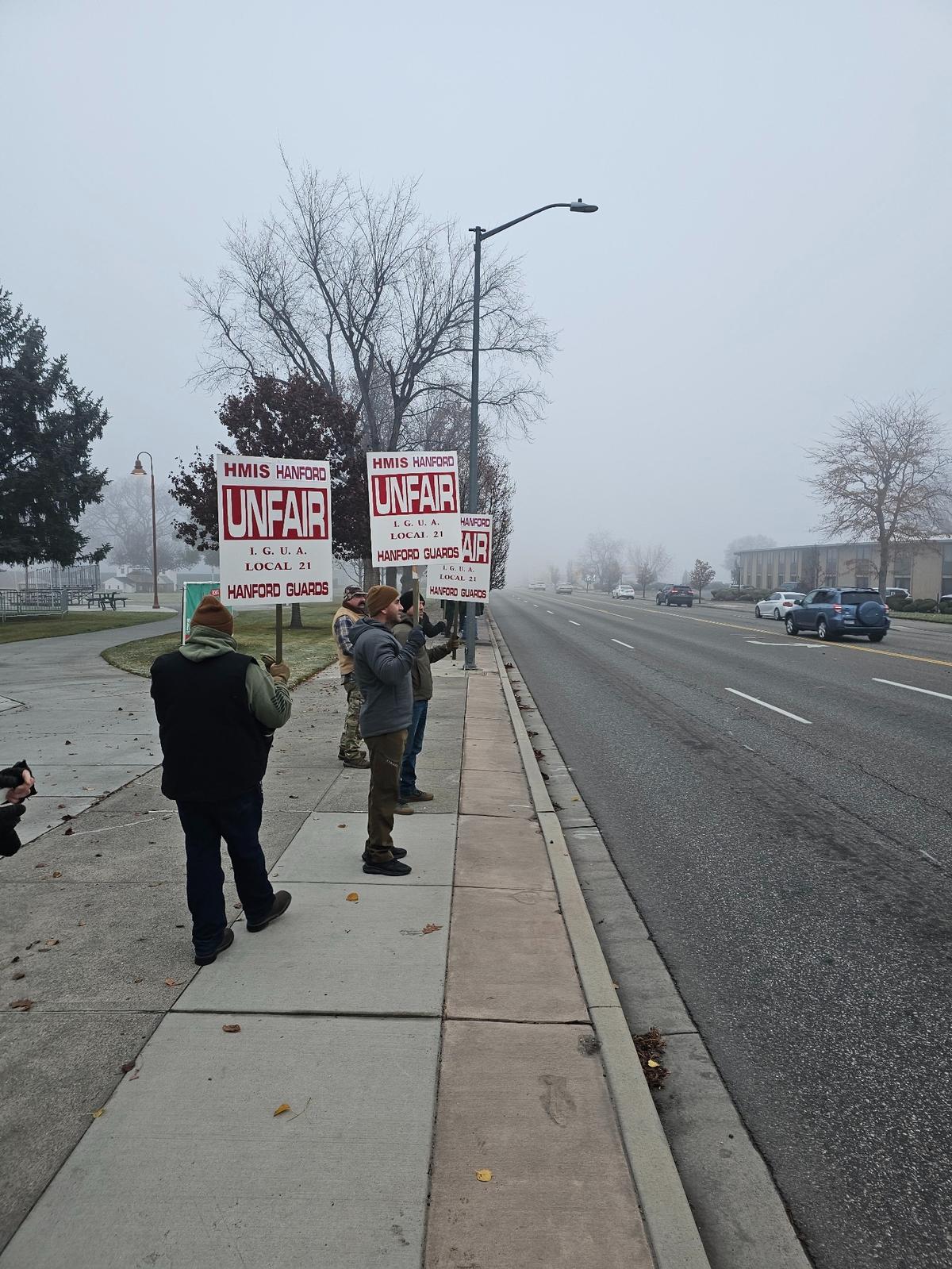 Members of the Hanford Guards Unit picketed Wednesday morning along George Washington Way in Richland after their contract expired and they were locked out of work.
