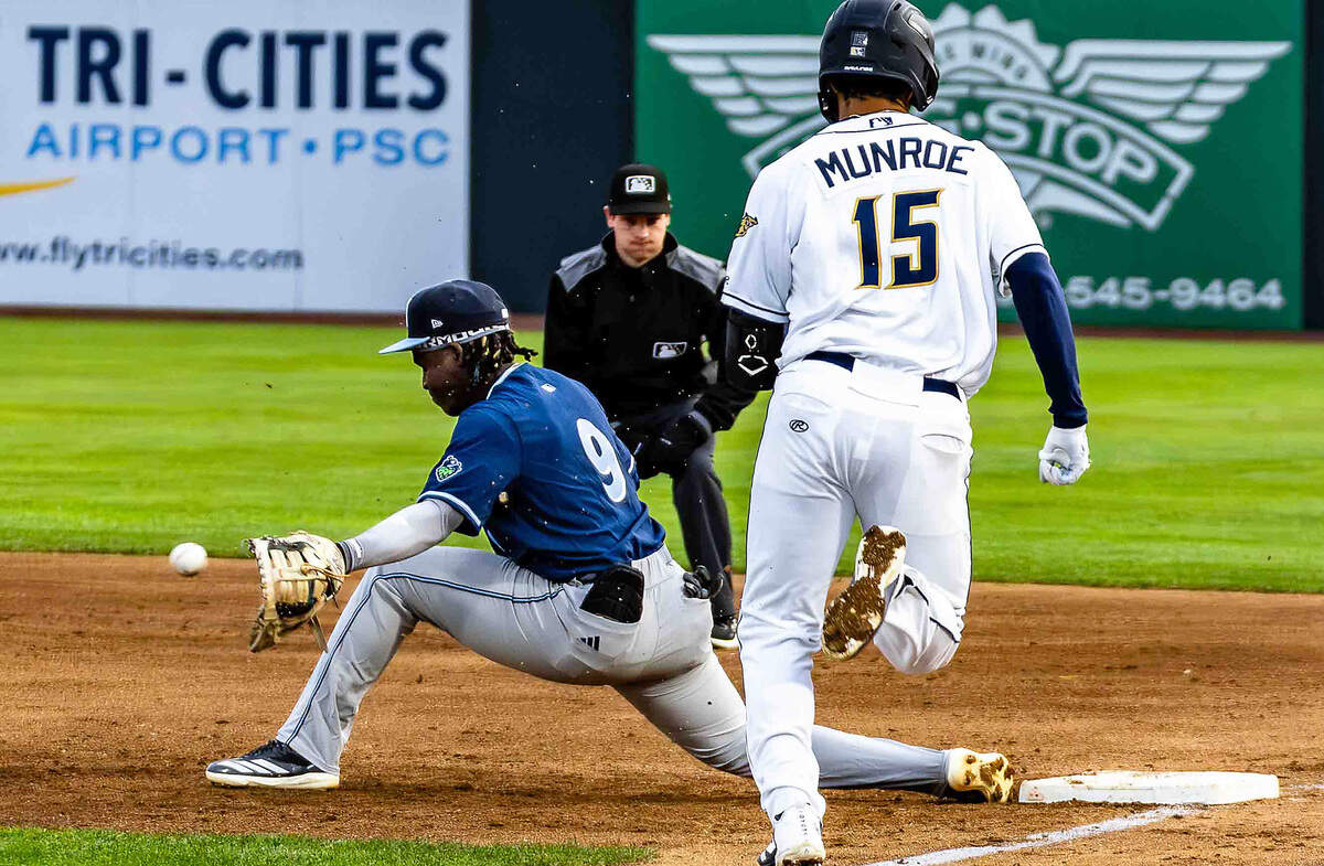 Tri-City Dust Devils third baseman Jake Munroe races to first base during a game earlier this season at Gesa Stadium in Pasco. Munroe ranks among the Dust Devils' top offensive threats with 10 home runs and 33 runs scored this season, helping power Tri-City's climb to second place in the Northwest League and an eight-game winning streak.