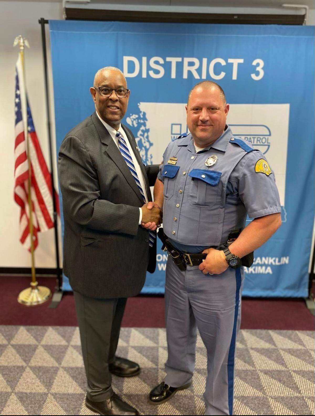Washington State Patrol Chief John R. Batiste stands with Trooper Chris Thorson.