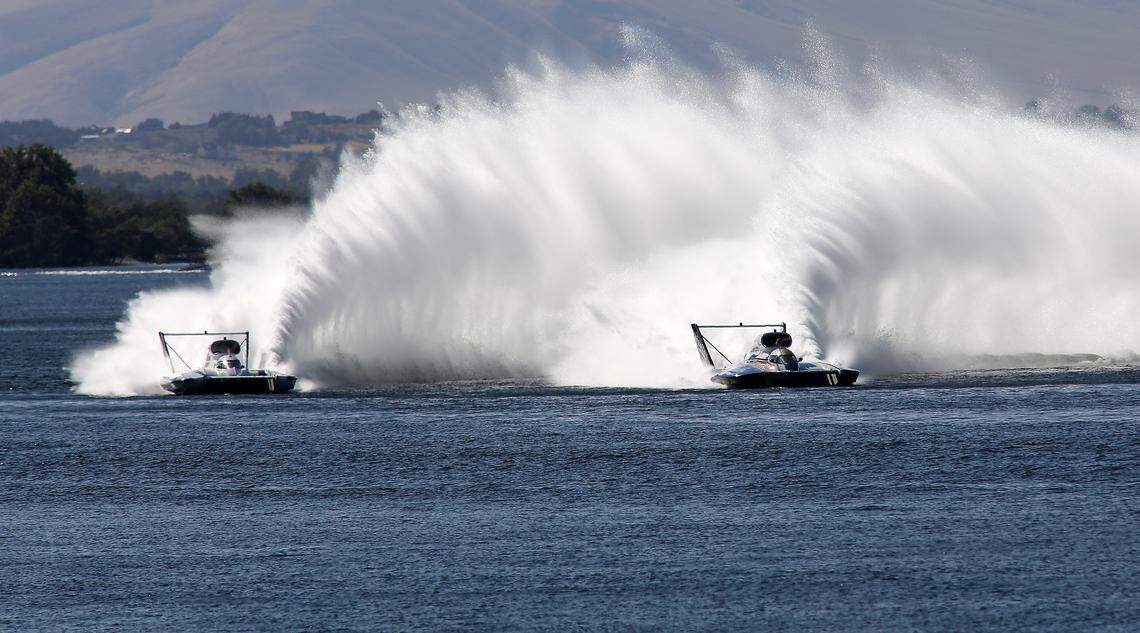 Corey Peabody in the U-9 Miss Beacon Plumbing and Dave Villwock in the U-27 Miss Apollo duel for postitio as they race in Heat 2A Saturday on the Columbia River. Peabody was the winner of the heat.