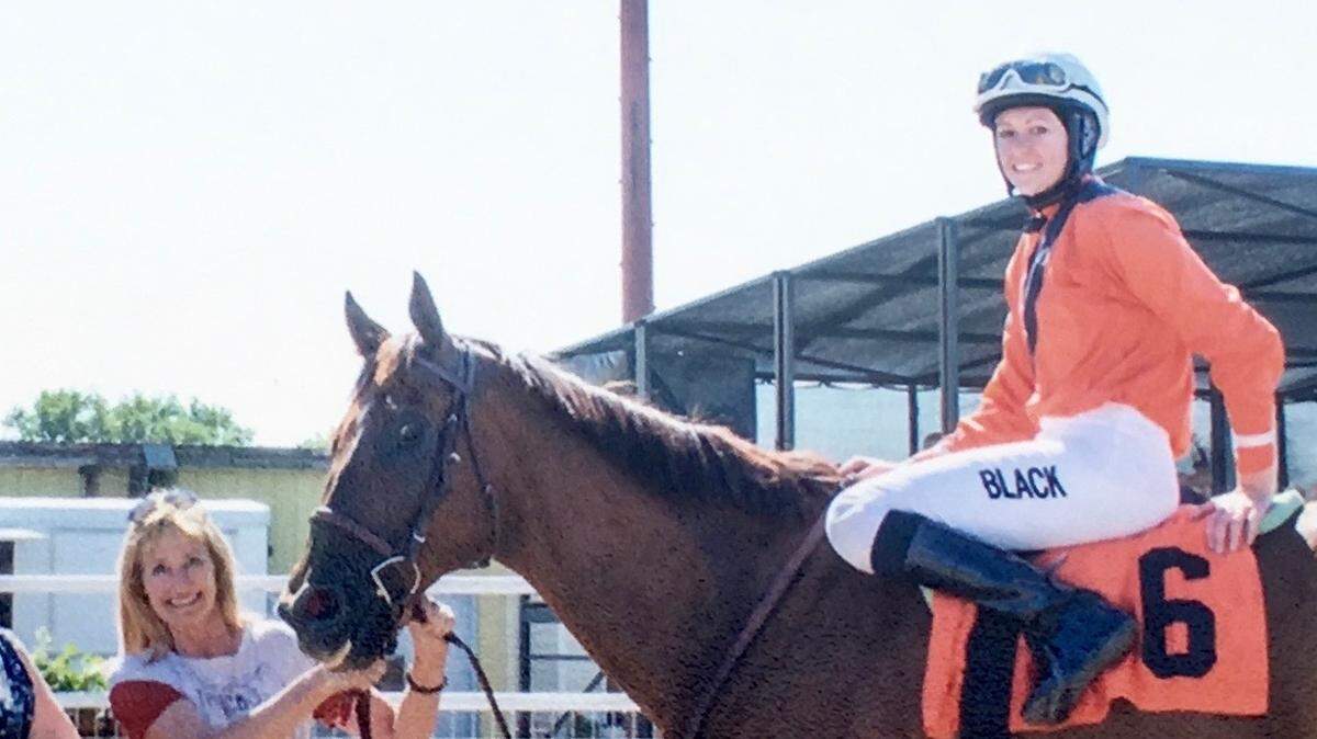Jackie Smith stands with Cantchaco and rider Nikeela Black in a photo from Great Falls in 2018.