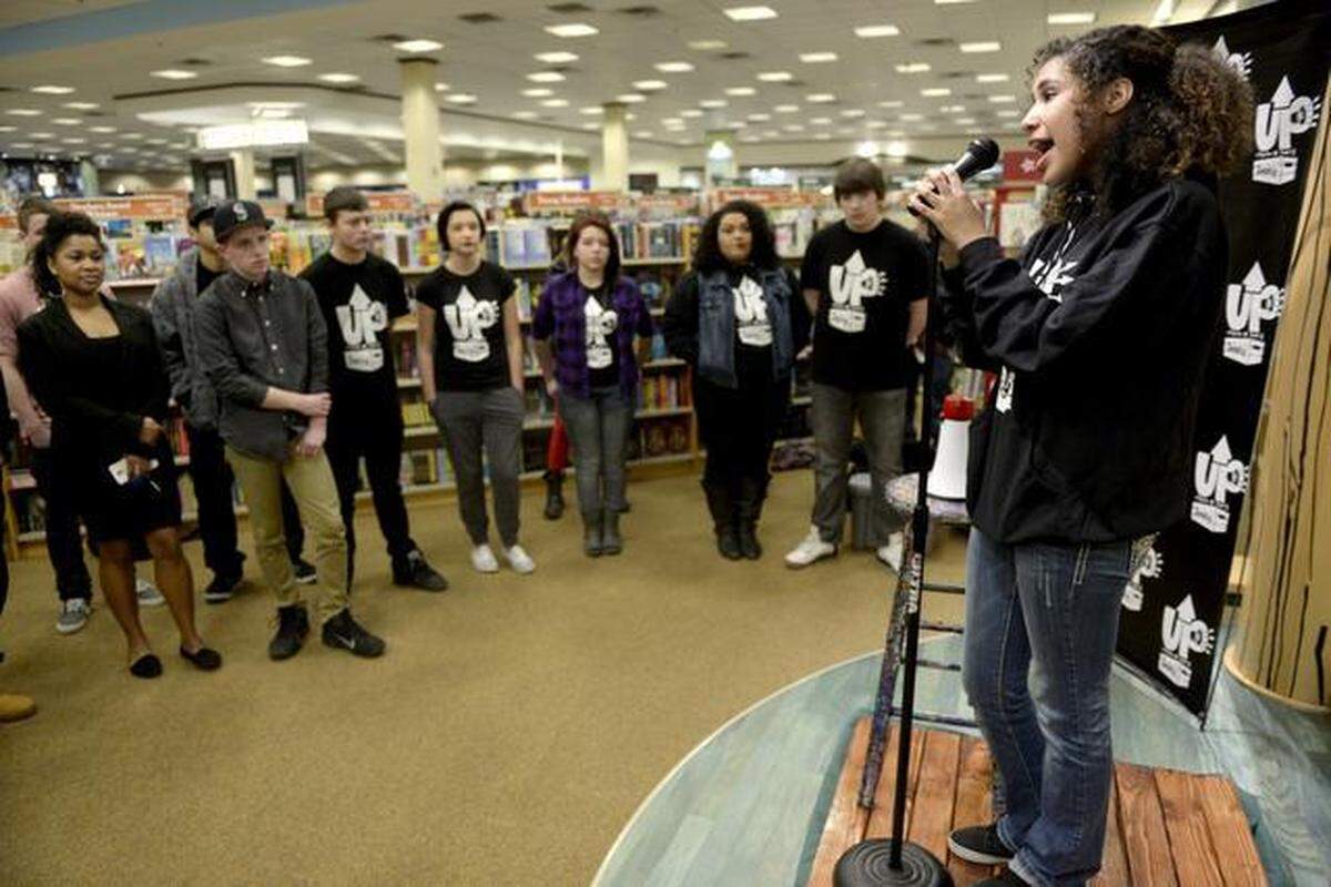 Alex Adams, 18, of Richland, sings in 2015 during a meeting of the Urban Poets Society at Barnes & Noble in Kennewick.