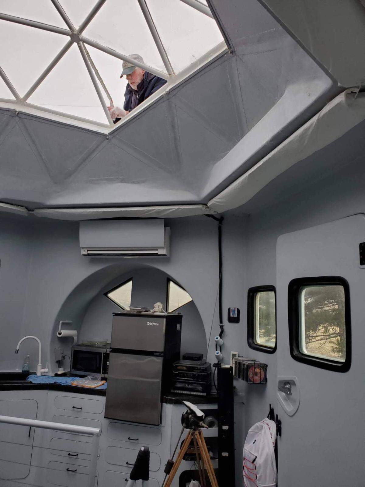 Architect Kurt Hughes works on the dome of his lunar lander dwelling in Beverly, Wash.